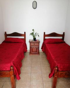 A bed or beds in a room at Hotel La Piedad