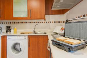 Kuchyňa alebo kuchynka v ubytovaní Residencial Vicaño VUT-PO-03856