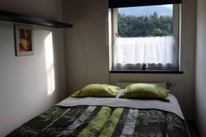 Postel nebo postele na pokoji v ubytování Mia Apartman, Eisenerz