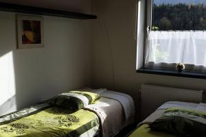 Postel nebo postele na pokoji v ubytování Mia Apartman, Eisenerz
