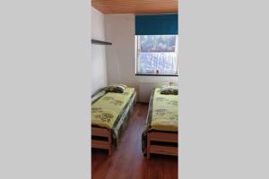 Postel nebo postele na pokoji v ubytování Mia Apartman, Eisenerz