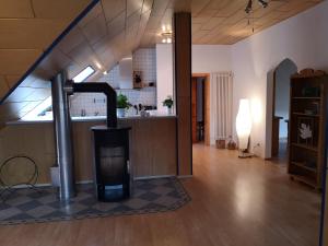 a living room with a wood stove in a room at Casa Mosella in Enkirch