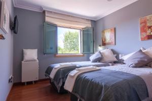 Posteľ alebo postele v izbe v ubytovaní Residencial Vicaño VUT-PO-03856