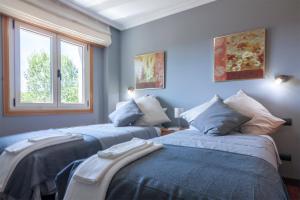 Posteľ alebo postele v izbe v ubytovaní Residencial Vicaño VUT-PO-03856