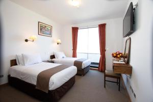 Postelja oz. postelje v sobi nastanitve DM Hoteles Cusco