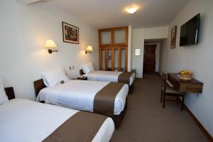 Postelja oz. postelje v sobi nastanitve DM Hoteles Cusco