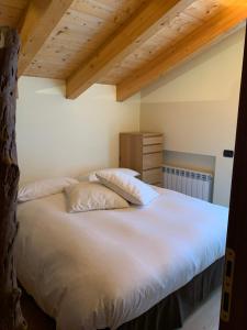 Postel nebo postele na pokoji v ubytování Chalet Nocciolini