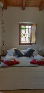 A bed or beds in a room at Trullo la perla di pietra