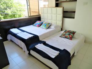 A bed or beds in a room at SAN JACINTO HOSTEL