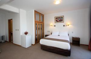 Postelja oz. postelje v sobi nastanitve DM Hoteles Cusco