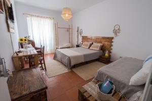 Postel nebo postele na pokoji v ubytování Casa do Mar - Nazaré