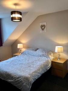 Postel nebo postele na pokoji v ubytování Glendona Lodge