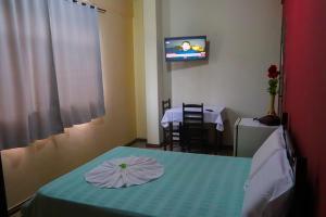 Tempat tidur dalam kamar di HOTEL PLAZA FERREIRA