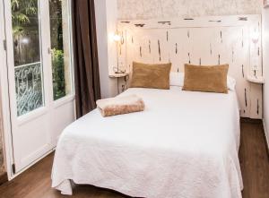 Łóżko lub łóżka w pokoju w obiekcie Casa da Balconada