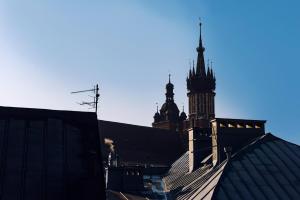 a building with a clock tower on top of it at MK Apartment 100m2 Friends&Family in Krakow