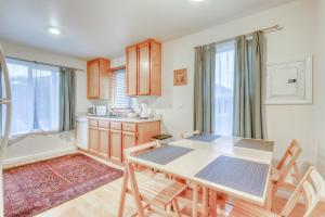 a kitchen with a table and chairs in a room at Seventh Street Select in Eureka