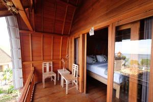 Postel nebo postele na pokoji v ubytování Adara Beach Huts