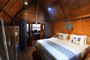 Postel nebo postele na pokoji v ubytování Adara Beach Huts