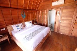 Postel nebo postele na pokoji v ubytování Adara Beach Huts