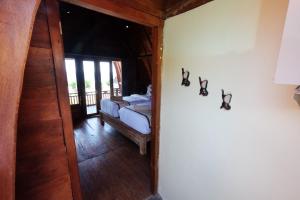 Postel nebo postele na pokoji v ubytování Adara Beach Huts