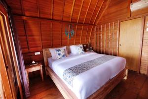 Postel nebo postele na pokoji v ubytování Adara Beach Huts