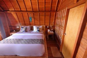 Postel nebo postele na pokoji v ubytování Adara Beach Huts