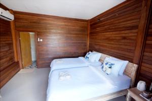 Postel nebo postele na pokoji v ubytování Adara Beach Huts