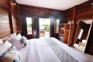 Postel nebo postele na pokoji v ubytování Adara Beach Huts