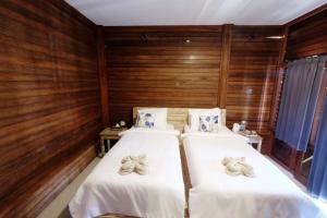 Postel nebo postele na pokoji v ubytování Adara Beach Huts