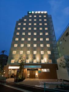 a tall building with lights on top of it at Sotetsu Fresa Inn Kamakura-Ofuna kasamaguchi in Kamakura