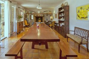 a large wooden table in a living room at Finca Antonio in Búger