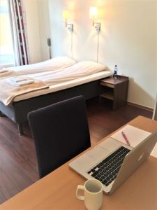 En eller flere senger på et rom på Victoria Hotel Kragerø