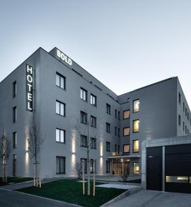 a rendering of the front of the hotel at Bold Hotel München Giesing in Munich