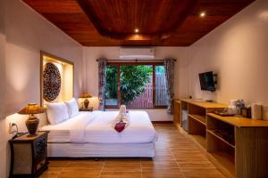 Postel nebo postele na pokoji v ubytování Nice Beach Resort Koh Pha-ngan + 37 fotografií