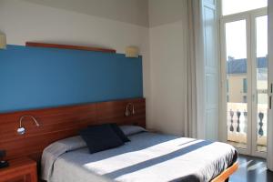 En eller flere senger på et rom på Hotel Europa Varese