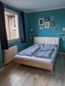 Una cama o camas en una habitación de Ruhrtropolis Hostel