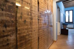 a hallway with a wall of wood paneling at Appartamenti Venezia in Venice