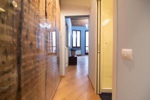 a hallway with a wooden wall and a hallway with a hallway at Appartamenti Venezia in Venice