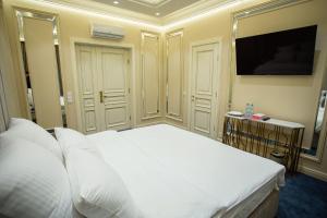 
Кровать или кровати в номере Le Maran
