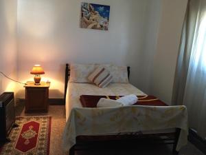 Ein Bett oder Betten in einem Zimmer der Unterkunft Chez Amel Guoumi