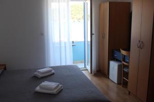Postel nebo postele na pokoji v ubytování Sobe MaMaLu