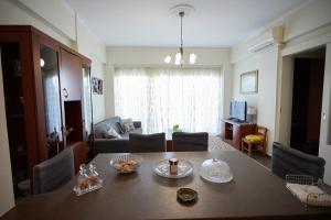 a living room with a dining table and a living room at Karfas sea view apartment in Karfas