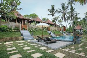 Bazén v ubytování KERAMAN SUITE UBUD nebo v jeho okolí