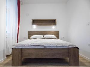 Postel nebo postele na pokoji v ubytování Jantar Apartmaji