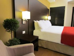 Tempat tidur dalam kamar di Hotel Principe