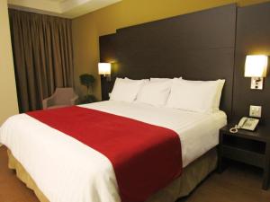 Tempat tidur dalam kamar di Hotel Principe