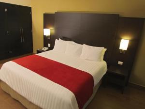 Tempat tidur dalam kamar di Hotel Principe