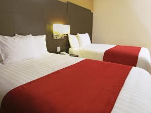 Tempat tidur dalam kamar di Hotel Principe