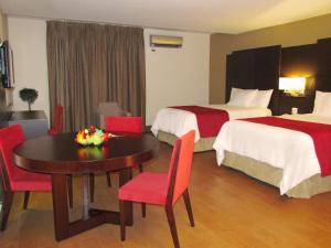 Tempat tidur dalam kamar di Hotel Principe
