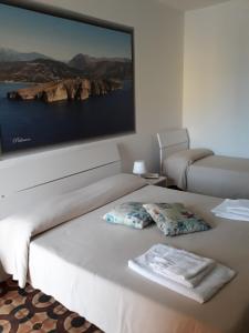 Postel nebo postele na pokoji v ubytování Hotel Rosy